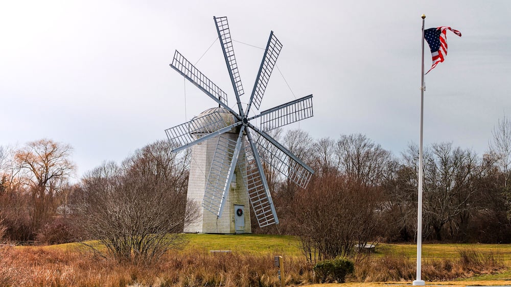 Boyd's Windmill, also known as Boyd's Wind Grist Mill, is a historic smock mill in Middletown, Rhode Island. John Peterson built the windmill in 1810, and William Boyd purchased it in 1815. It originally had four common sails, but four more were added by the family. The mill is a timber-frame structure, octagonal in shape, and about 30 feet (9.1 m) tall, with a rotating cap powered by eight vanes with canvas sheets.
The mill is located on a public area so the grounds are open. The windmill itself is open to the public on Sunday afternoons in July, August and September.
#windmill #travel