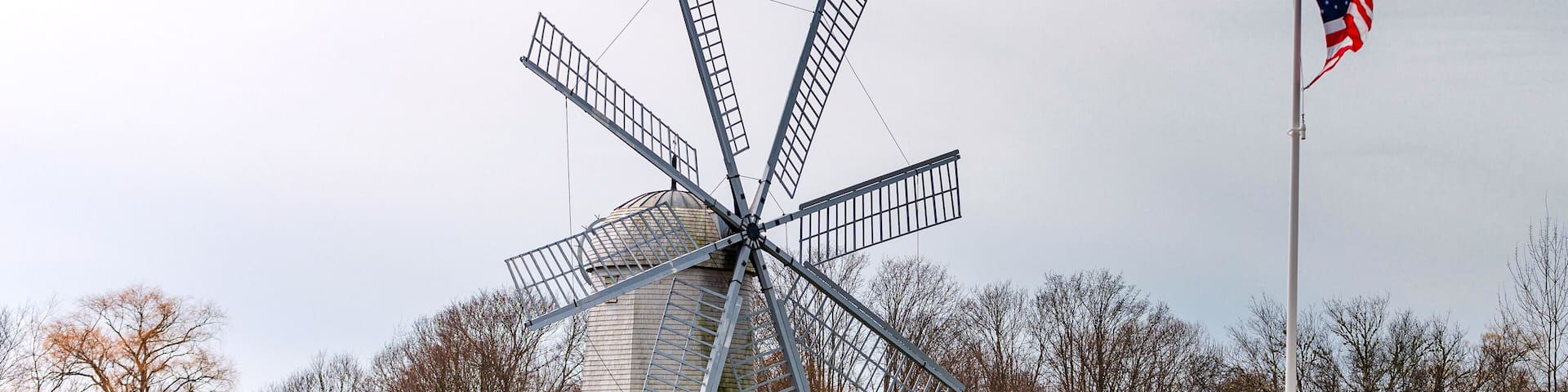 Boyd's Windmill, also known as Boyd's Wind Grist Mill, is a historic smock mill in Middletown, Rhode Island. John Peterson built the windmill in 1810, and William Boyd purchased it in 1815. It originally had four common sails, but four more were added by the family. The mill is a timber-frame structure, octagonal in shape, and about 30 feet (9.1 m) tall, with a rotating cap powered by eight vanes with canvas sheets.
The mill is located on a public area so the grounds are open. The windmill itself is open to the public on Sunday afternoons in July, August and September.
#windmill #travel