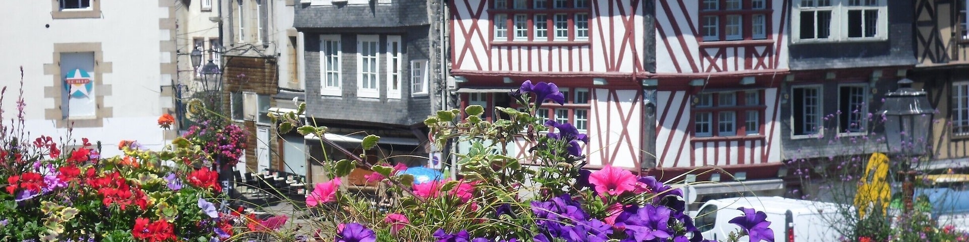 morlaix, Brittany in the summertime. Interesting, very histric with medieval buildings. There is an estuary with yachts and a magnificent viaduct which you can walk across to maximise views. Well worth the climb!