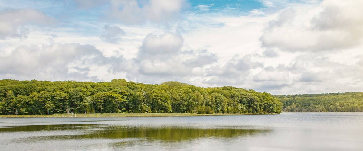 Beautiful landscape summer scene day view at Canadian Ontario Kettles lake in Midland area. Canada forest park nature and water reservoir. Web banner heaer for website.