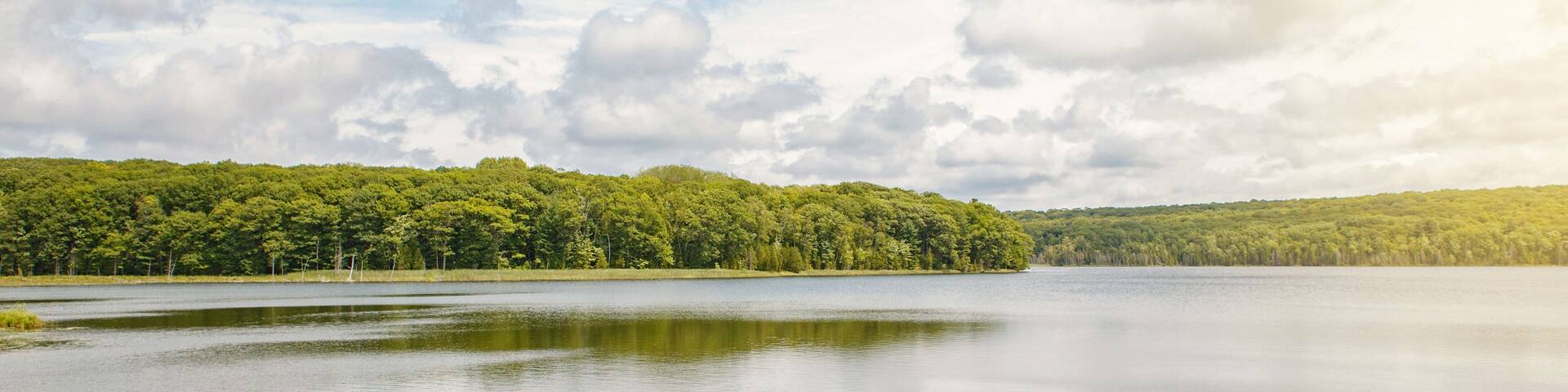 Beautiful landscape summer scene day view at Canadian Ontario Kettles lake in Midland area. Canada forest park nature and water reservoir. Web banner heaer for website.