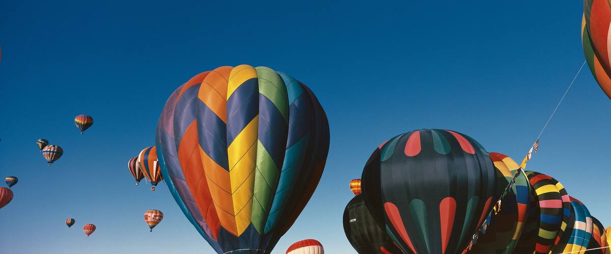 This is the 25th Annual Albuquerque International Balloon Fiesta. It shows the mass ascension of colorful balloons.