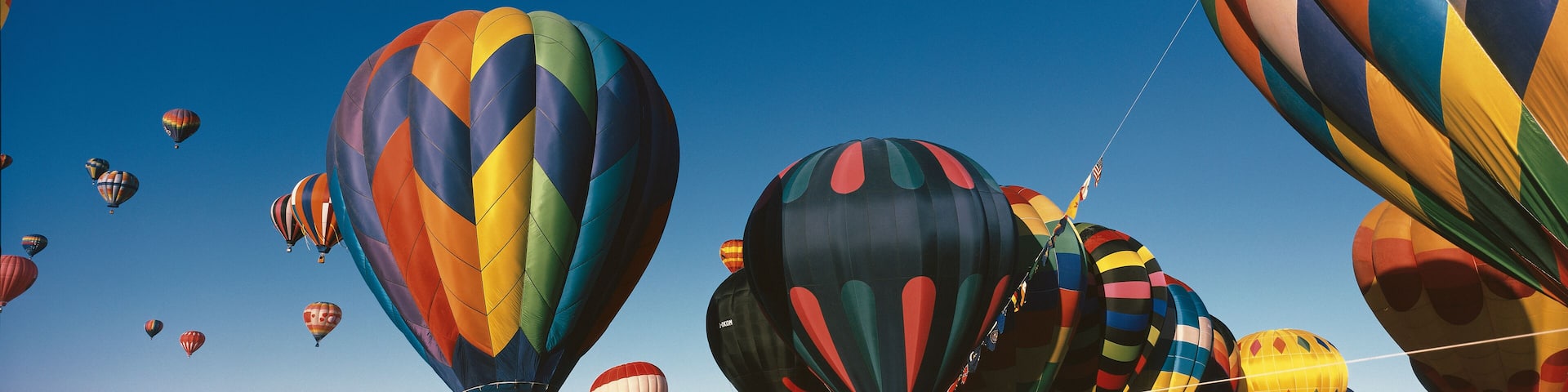 This is the 25th Annual Albuquerque International Balloon Fiesta. It shows the mass ascension of colorful balloons.
