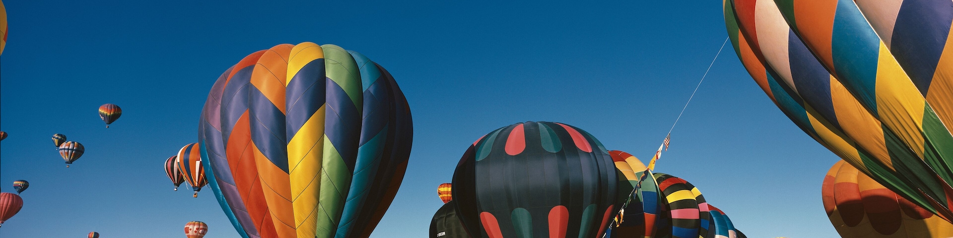 This is the 25th Annual Albuquerque International Balloon Fiesta. It shows the mass ascension of colorful balloons.
