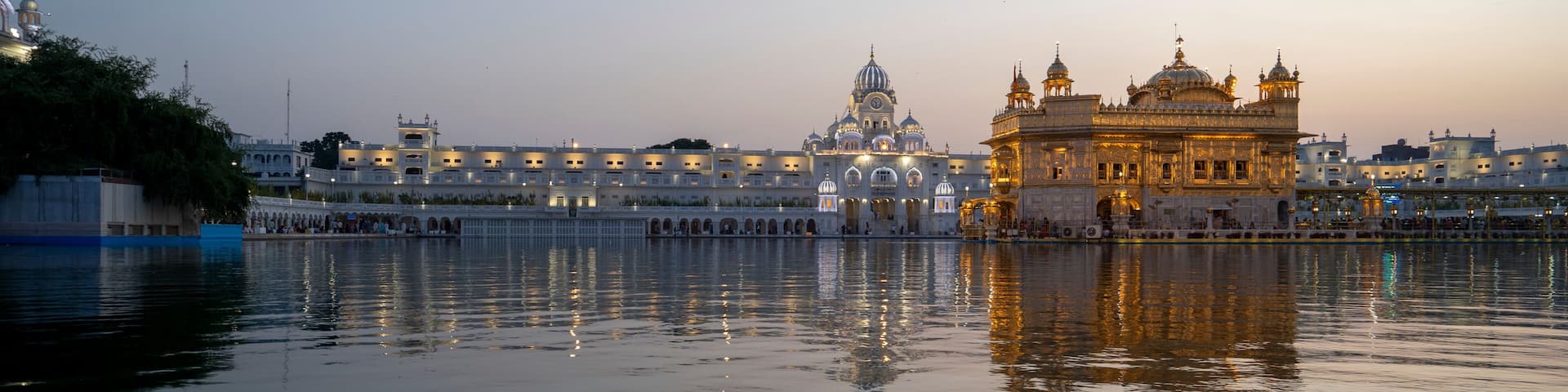 The Golden Temple (Sri Harmandir Sahib) Gurdwara and Sarovar (Pool of Nectar), at dusk; Amritsar, Punjab, India