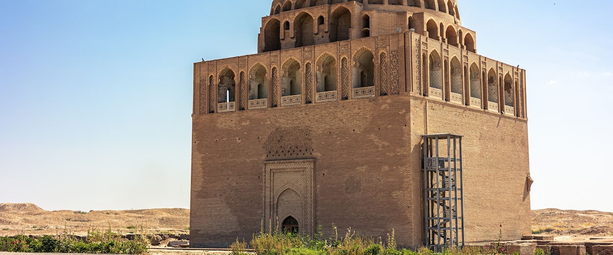 A large, domed building with arched windows and a central entrance.