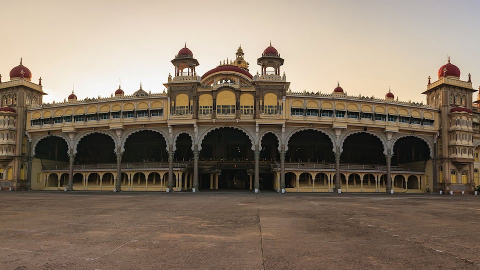 A large, ornate building with multiple domes and arches.