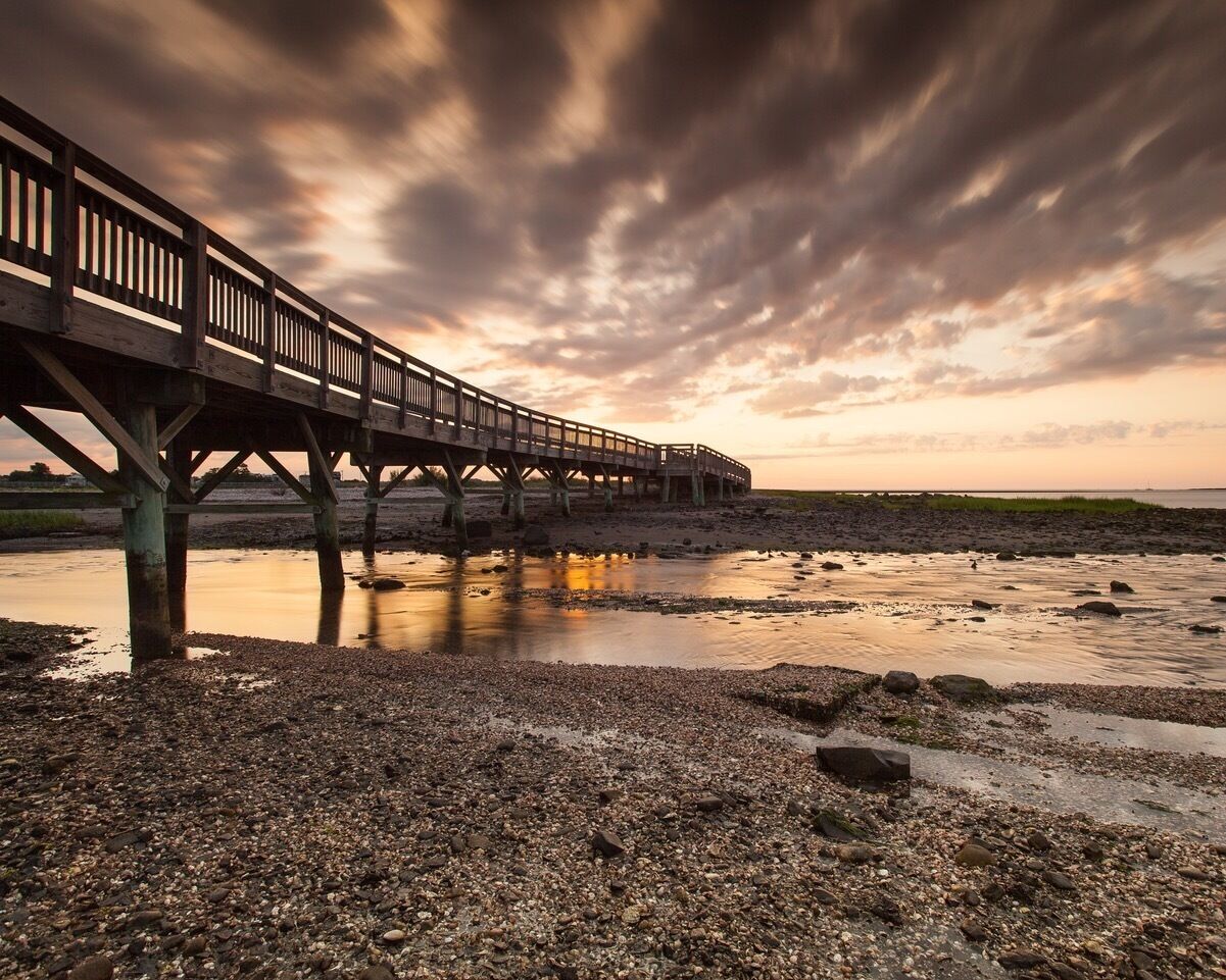 Yesterday morning I ventured out into my backyard Silver Sands Beach hoping for a image. Sky was kind of empty and sunrise was coming. I looked behind and saw a streak of clouds floating into my composition. They were to low to be under lit but awesome enough to add drama to my image. So greatful!!!