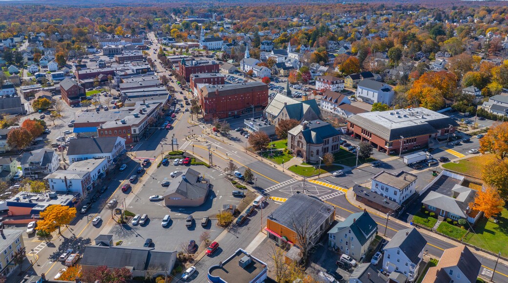 Historic commercial building in fall on Main Street in historic town center of Milford, Massachusetts MA, USA.
