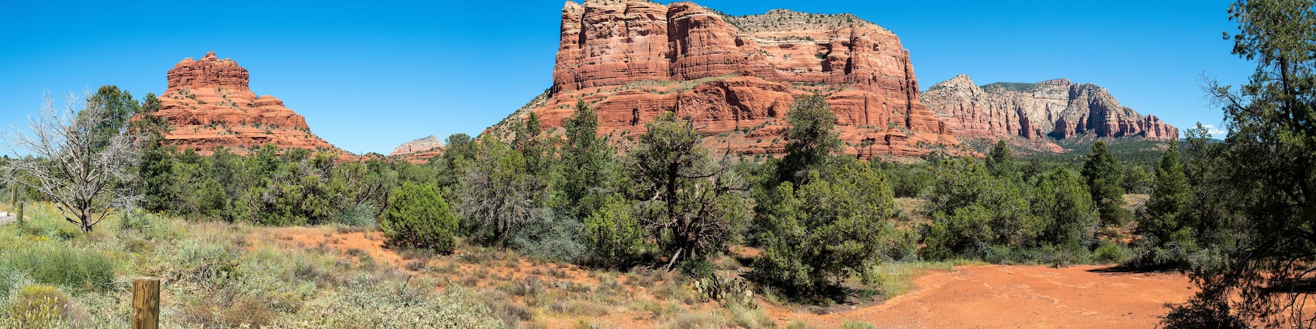 Panorama view of Bell Rock and Courthouse Butte from Red Rock Scenic Byway in Sedona, Arizona