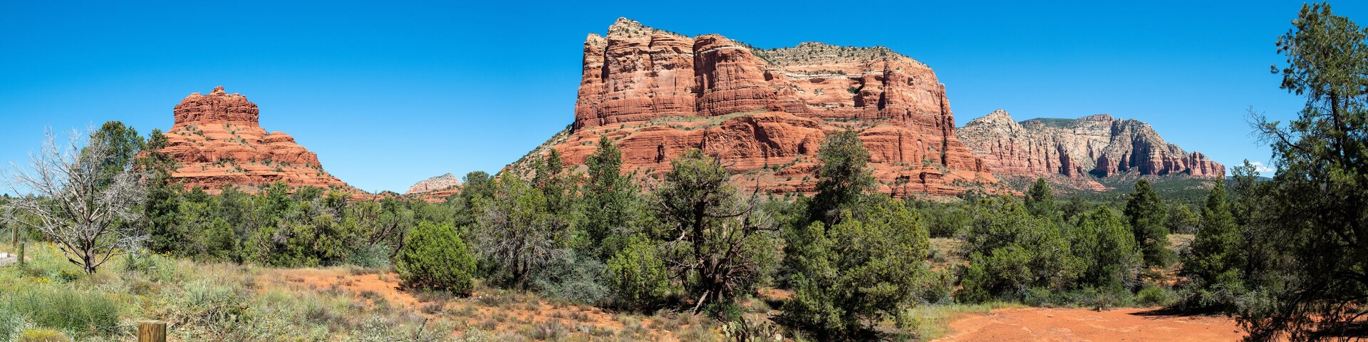 Panorama view of Bell Rock and Courthouse Butte from Red Rock Scenic Byway in Sedona, Arizona