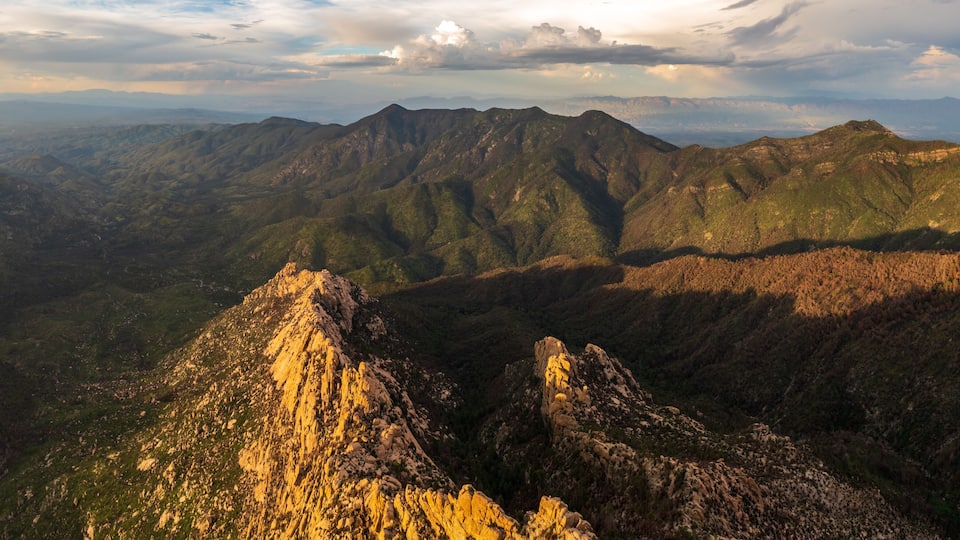 A mountainous landscape with rugged peaks and valleys.