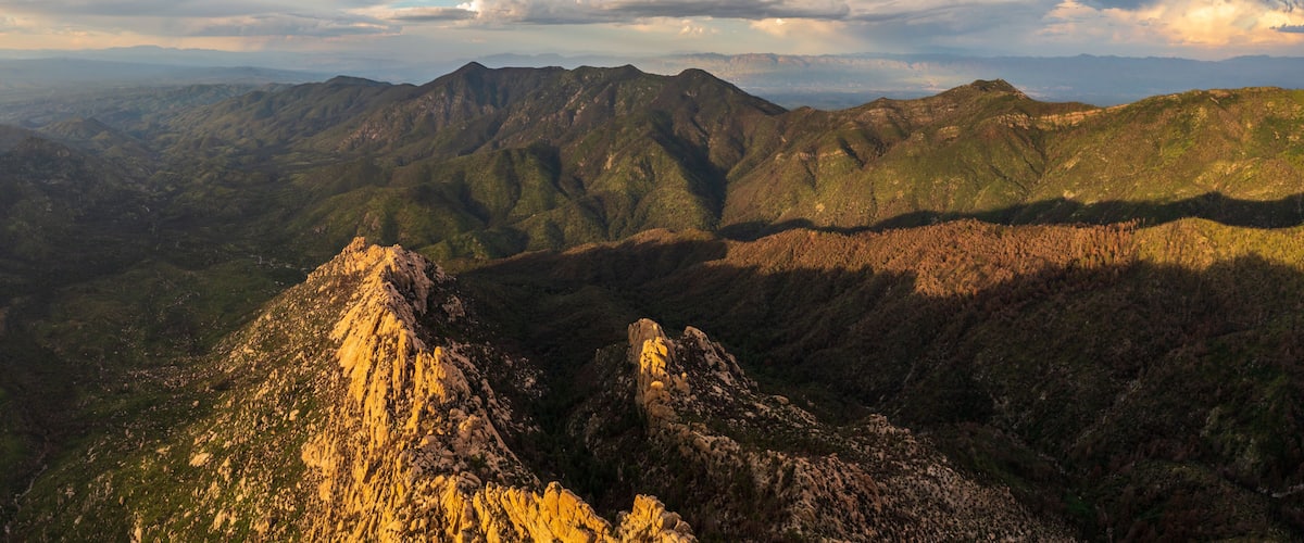 A mountainous landscape with rugged peaks and valleys.