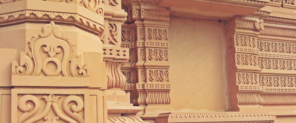 Detailed architectural carvings on a temple's facade.