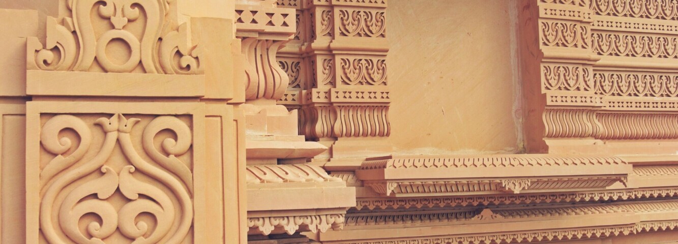 Detailed architectural carvings on a temple's facade.