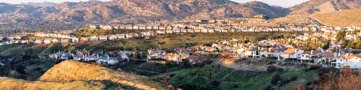 Hilltop houses overlooking the San Fernando Valley in northern Los Angeles, California. The Santa Susana Mountains are in the background.