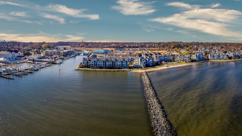Aerial view of Chesapeake Beach marina with luxury sail boats, beach house apartments, fishing boats near the water park popular vacation spot for Washington residents in Calvery county Maryland