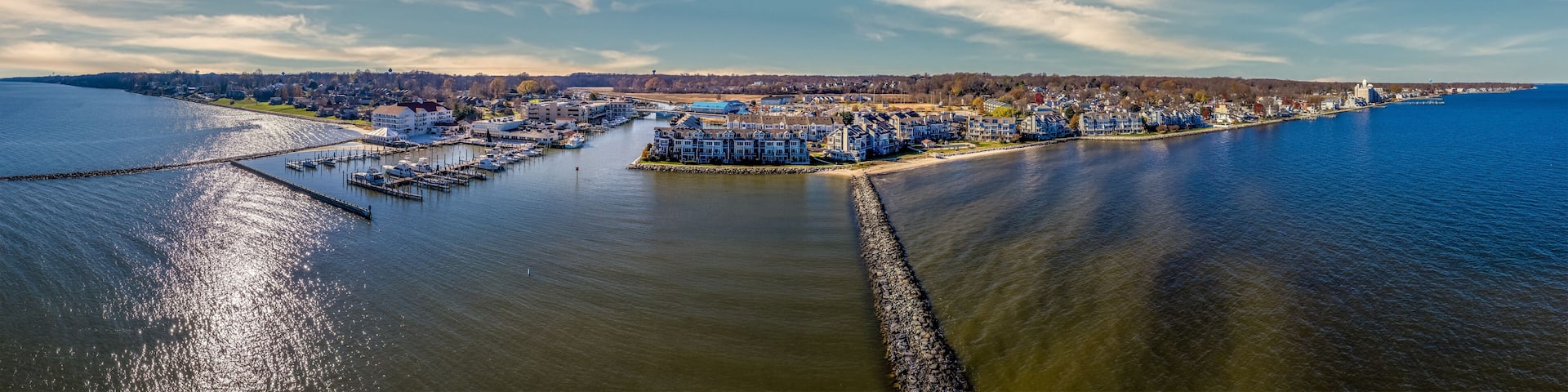 Aerial view of Chesapeake Beach marina with luxury sail boats, beach house apartments, fishing boats near the water park popular vacation spot for Washington residents in Calvery county Maryland