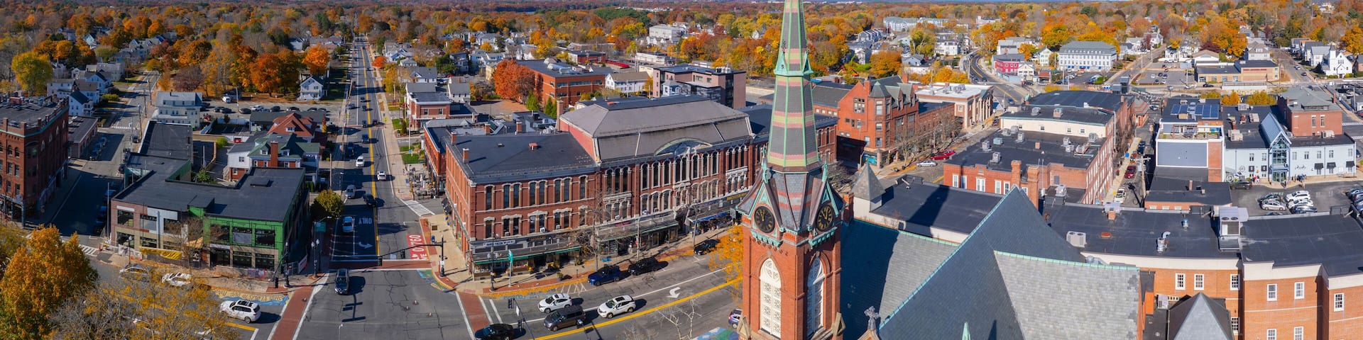 First Congregational Church aerial view in fall with foliage at 2 E Central Street in historic town center of Natick, Massachusetts MA, USA.