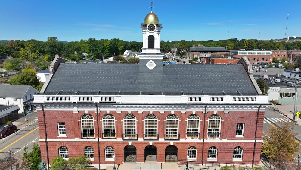 Needham Town Hall aerial view at 1471 Highland Avenue in historic town center of Needham, Massachusetts MA, USA.