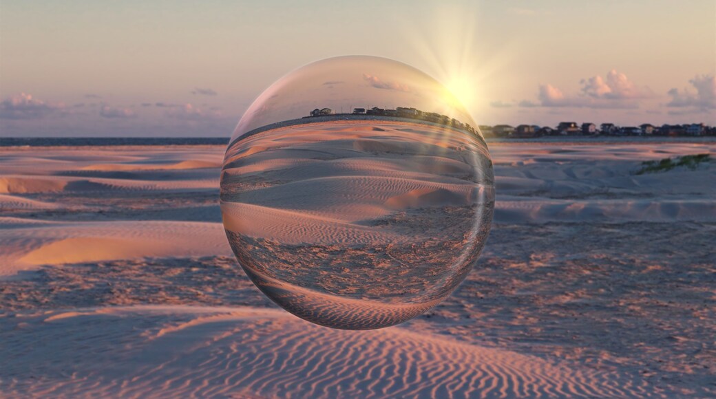 Sunset over the sandy beach on Galveston Island, Texas, USA. Artistic crystal ball effect.