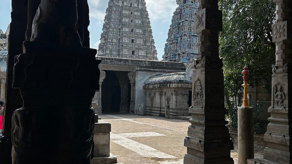 A temple with intricate carvings and a large, ornate tower.
