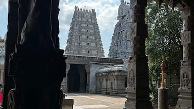 A temple with intricate carvings and a large, ornate tower.