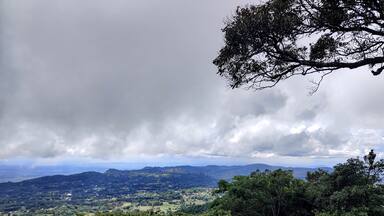 Beautiful landscape view of sky and clouds from the top of the hill. South Indian hill station.