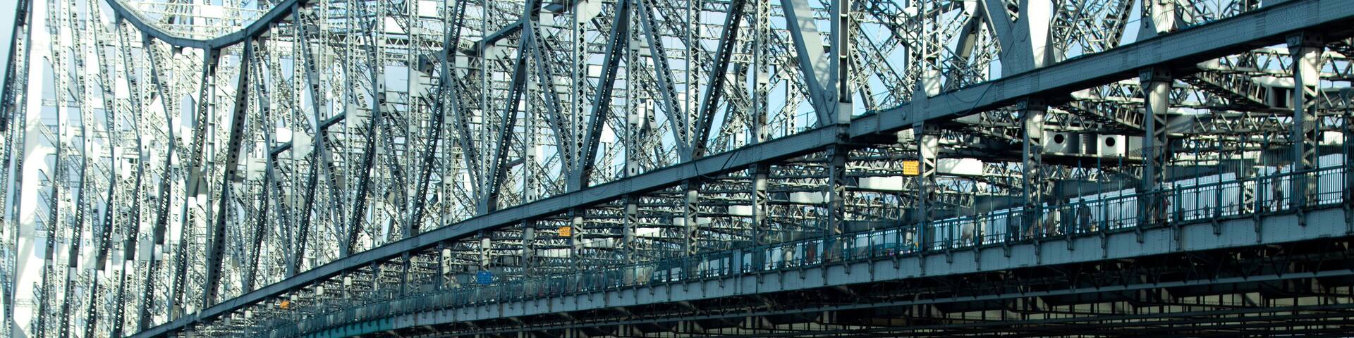 iconic Howrah bridge or Rabindra Setu of Kolkata and boat in river Ganges