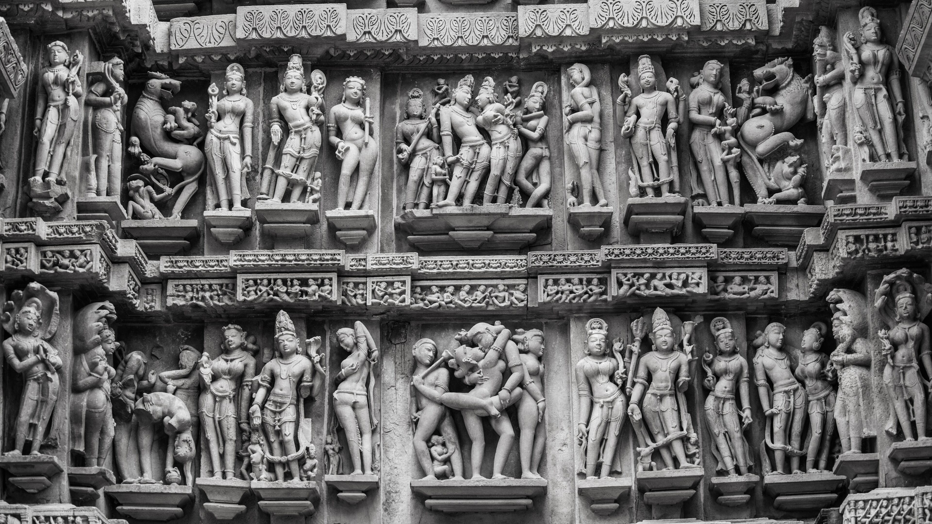 A detailed stone carving of multiple figures in various poses, likely depicting a historical or religious scene.