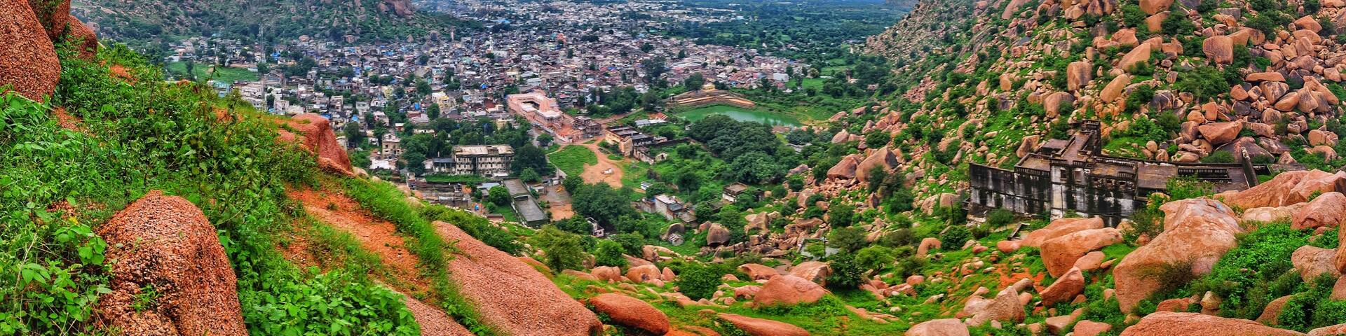 A mountainous landscape with a town nestled in the valley.