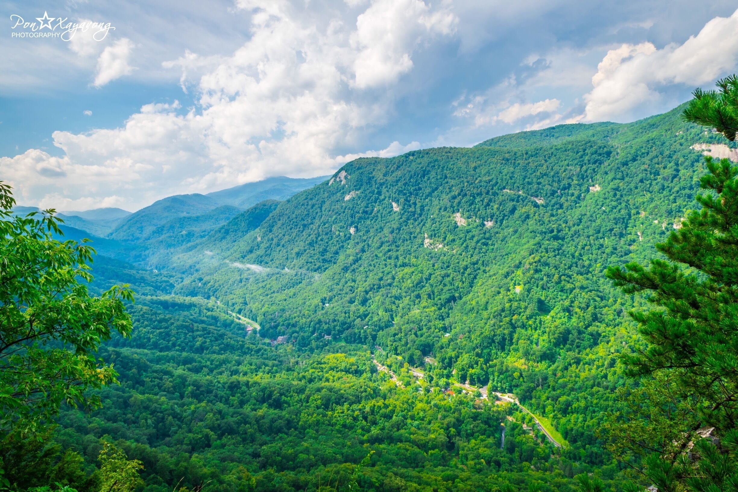 
When you get to this point along the Skyline trail you can exclaim, “I have reached the highest point in Chimney Rock!” At an elevation of 2,480 feet, Exclamation Point is the pinnacle of the Park. It exceeds Chimney Rock’s elevation by 200 feet. Standing here, you can feel proud and justifiably weary because you have just driven and hiked over 1,400 vertical feet from the entrance to the Park, which you can see way, way down in the valley. 