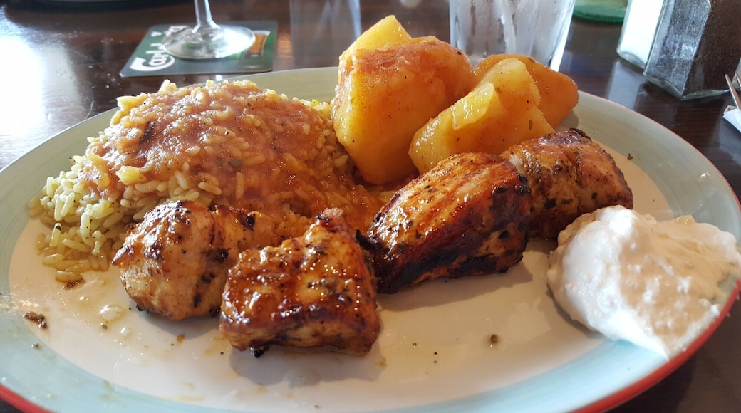 Greek restaurant; chicken souvlaki, rice, potatoes, and tzatziki.