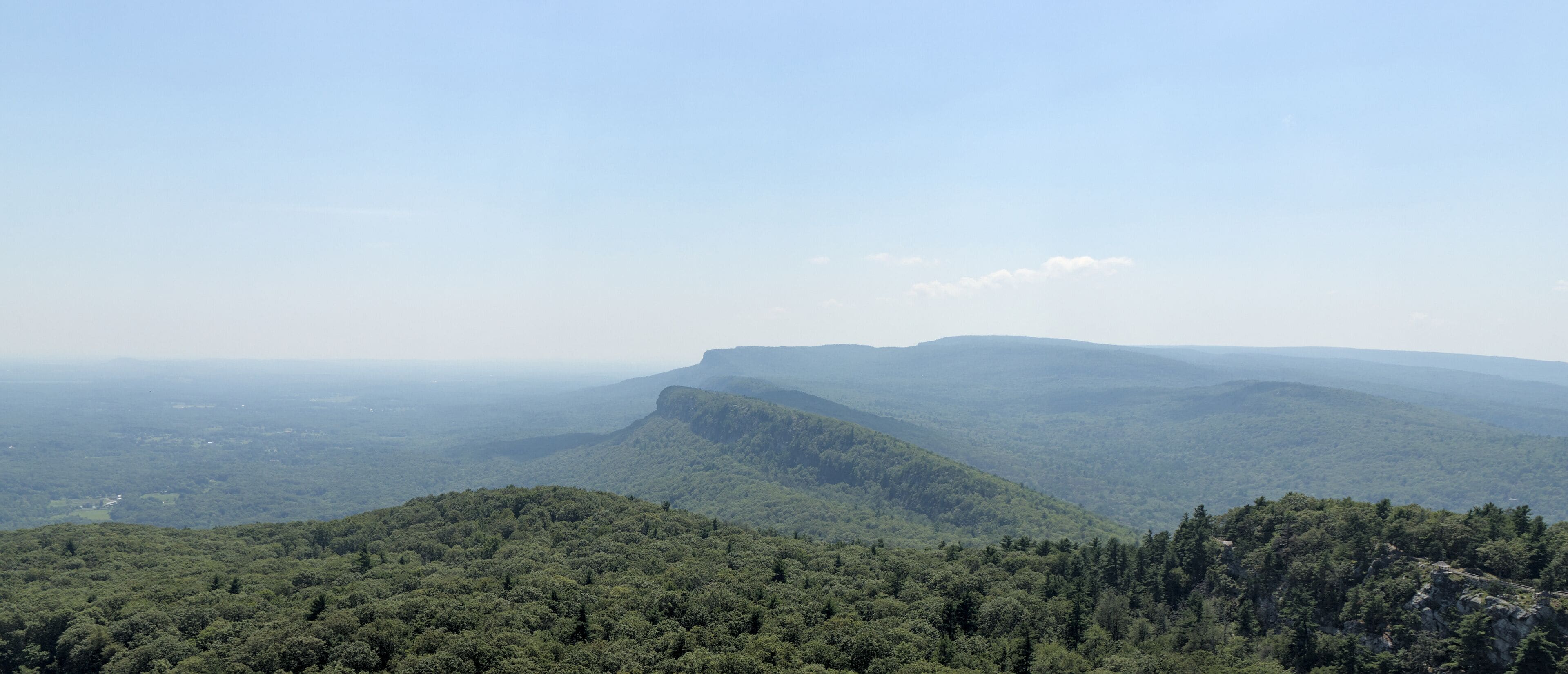 scenic view of shawangunk ridge mountain hazy landscape from mohonk preserve sky top tower hiking trail beautiful blue hills glacial rock