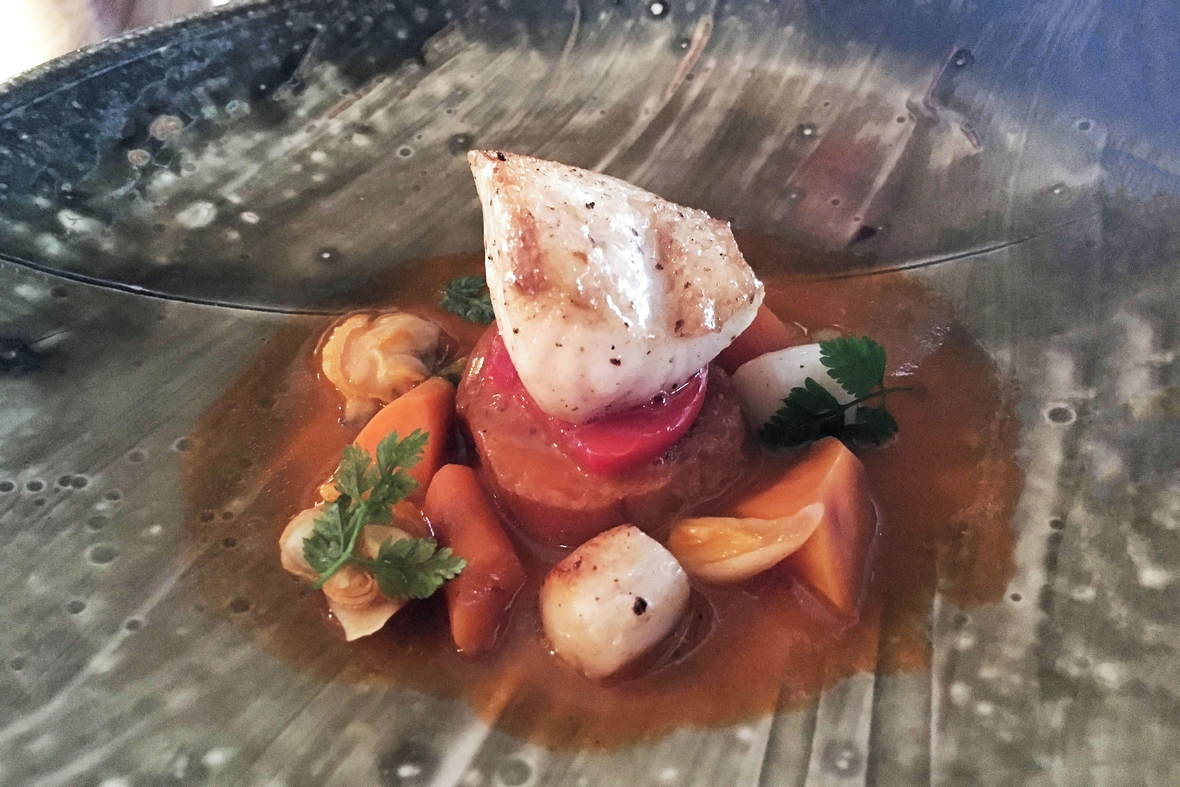 Just a sample of the elegant and tasty courses Chef Routt will offer.  Here we have black cod, Manilla clams, Bay scallops, saffron, summer tomatoes, and a baguette.