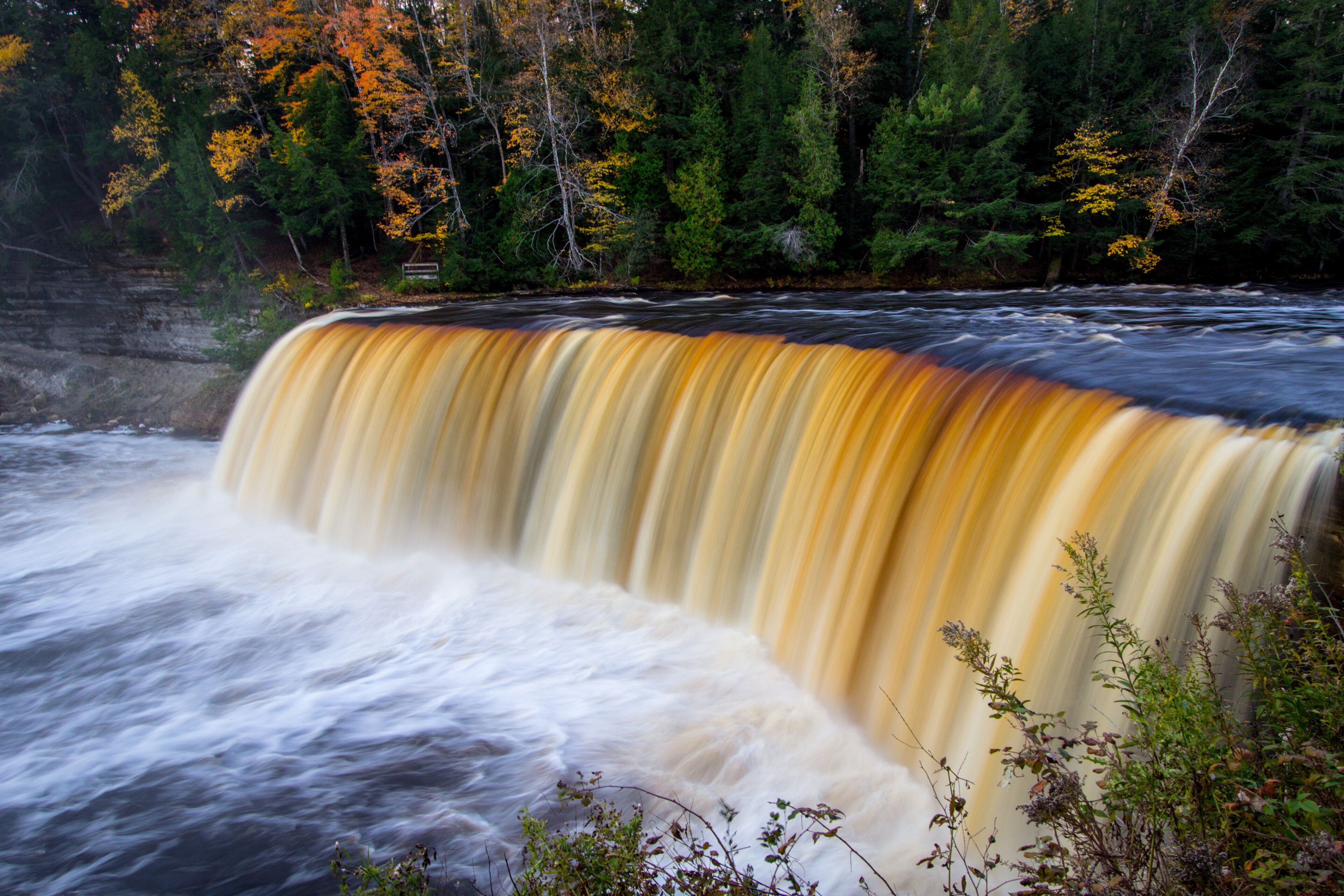 Autumn Waterfall Landscape Panorama. Tahquamenon Falls landscape in autumn in panoramic orientation. Tahquamenon Falls State Park, Upper Peninsula, Michigan. 