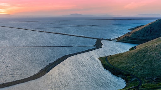 Vibrant Panoramic Sunset over San Francisco Bay via Coyote Hills Regional Park. Fremont, Alameda County, California, USA.