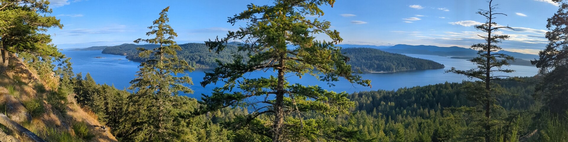 Panorama overlooking the Salish Sea and Pender Island taken from a hillside on Mayne Island Canada