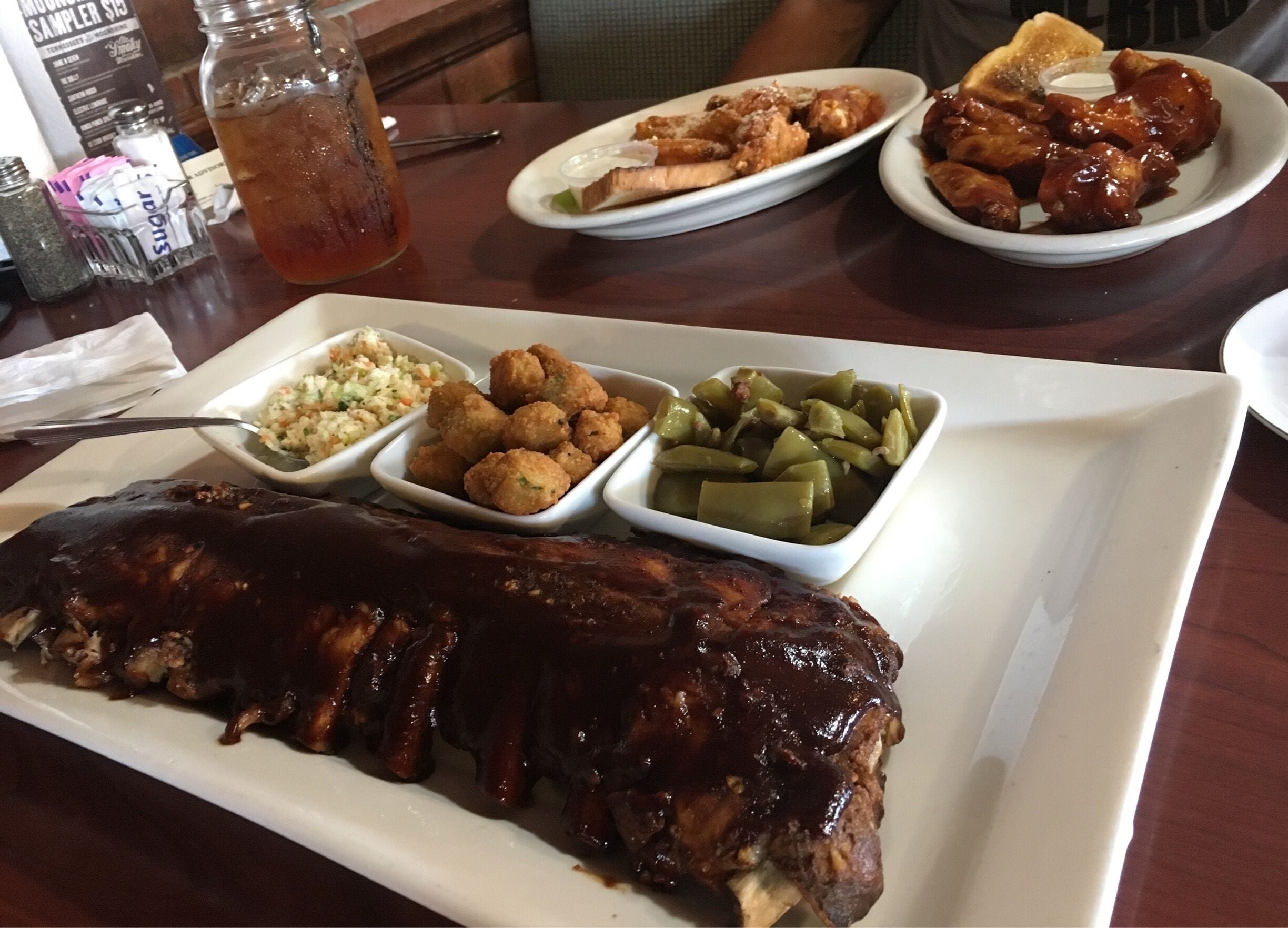 Hickory Ribs, honey BBQ and garlic Parmesan wings were to die for!!! The meat fell right off the bone! Sides were perfection as well! Highly recommend!  Staff were all amazing! And don't forget about the sweet tea! 