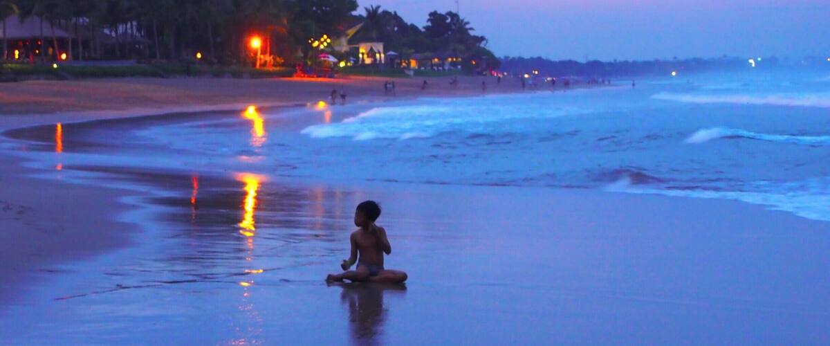 Seminyak Beach in Kuta, Bali is a good place to watch the sunset in one of their many beach bars. The waves were enormous so not good for swimming, at least during the rainy season.