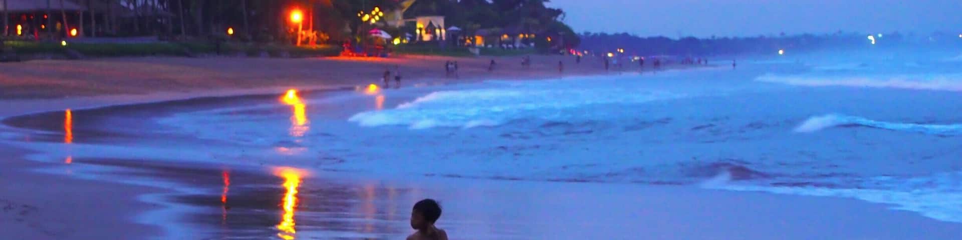 Seminyak Beach in Kuta, Bali is a good place to watch the sunset in one of their many beach bars. The waves were enormous so not good for swimming, at least during the rainy season.