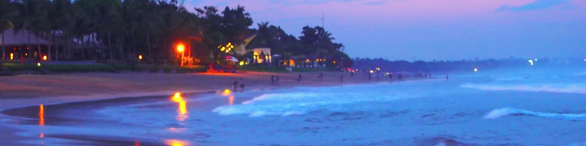 Seminyak Beach in Kuta, Bali is a good place to watch the sunset in one of their many beach bars. The waves were enormous so not good for swimming, at least during the rainy season.
