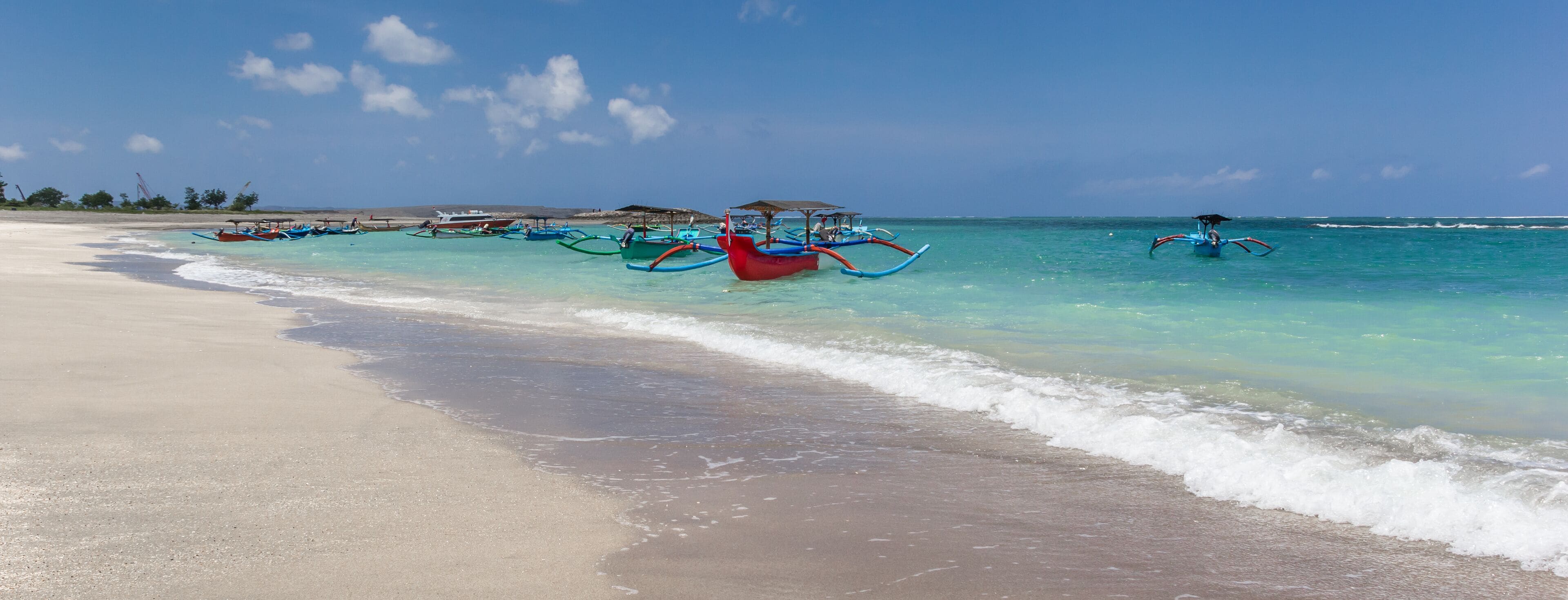 Panorama of the white sandy beach of Kuta on Bali, Indonesia; Shutterstock ID 1228602448; Purchase Order: SP-2381; Order Number: SP-2381 STAYZ/VRBO/BOOKABACH Nov 2019 - Image Research; Client/Licensee