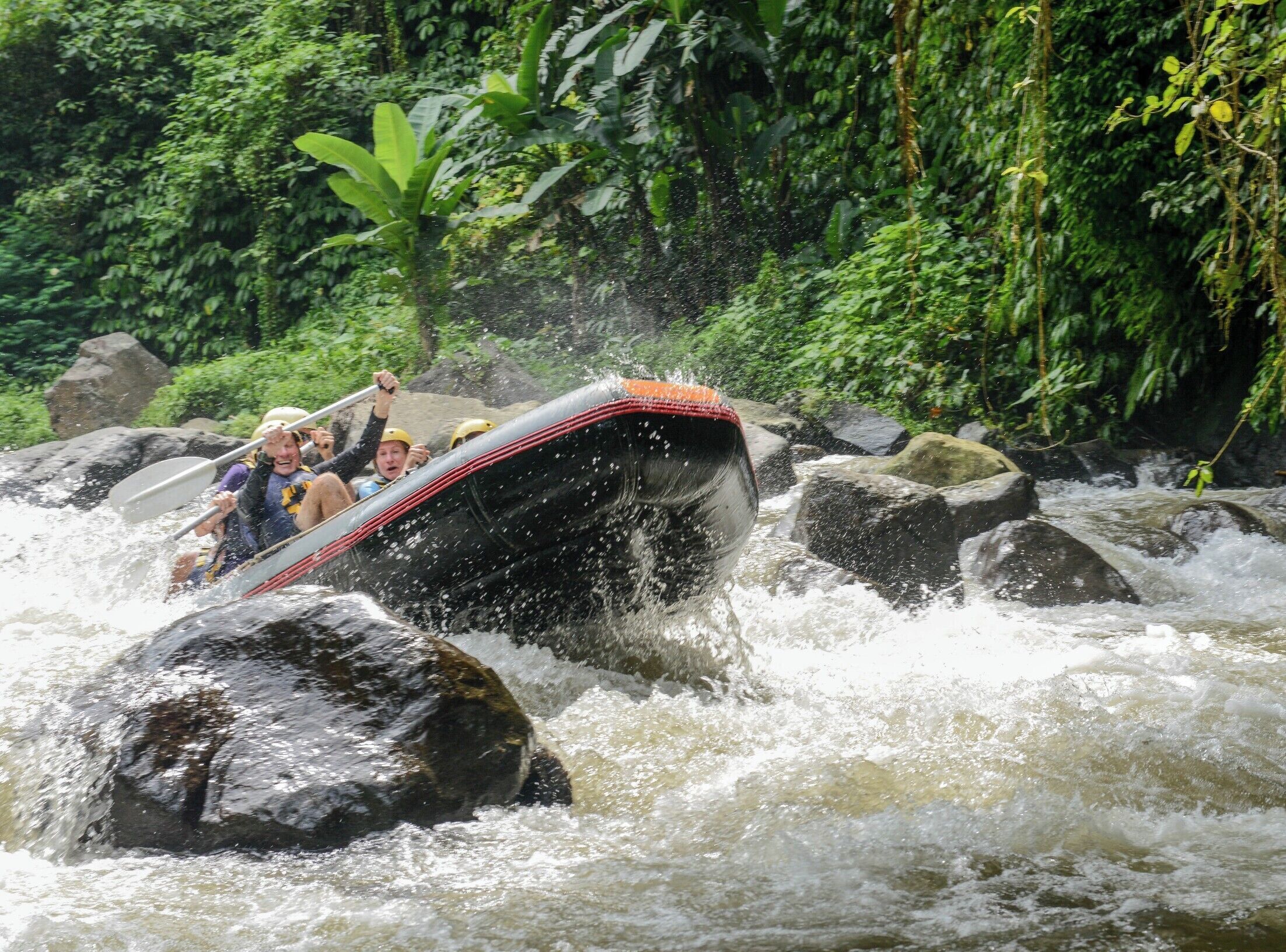  We went White Water Rafting on the Ayung River with Bali Adventure Tours outfitter and they could not have been more accommodating to our group. The experience was truly Epic ! One thing to be aware of is the steep trek down to and up from the river. 200+ stairs... if you have weak knees or you are not in good shape you might want to think about it. 

Once on the river you will experience class 2-3 rapids. You are deep in the canyon and will feel very small. Theres a lot of canopy, tons of bamboo, flora and fauna. I did not feel I needed sunscreen as there was mostly shade. The water was cool to cool and a refreshing reprieve from the hot and humid climate. 

I would do this one again !