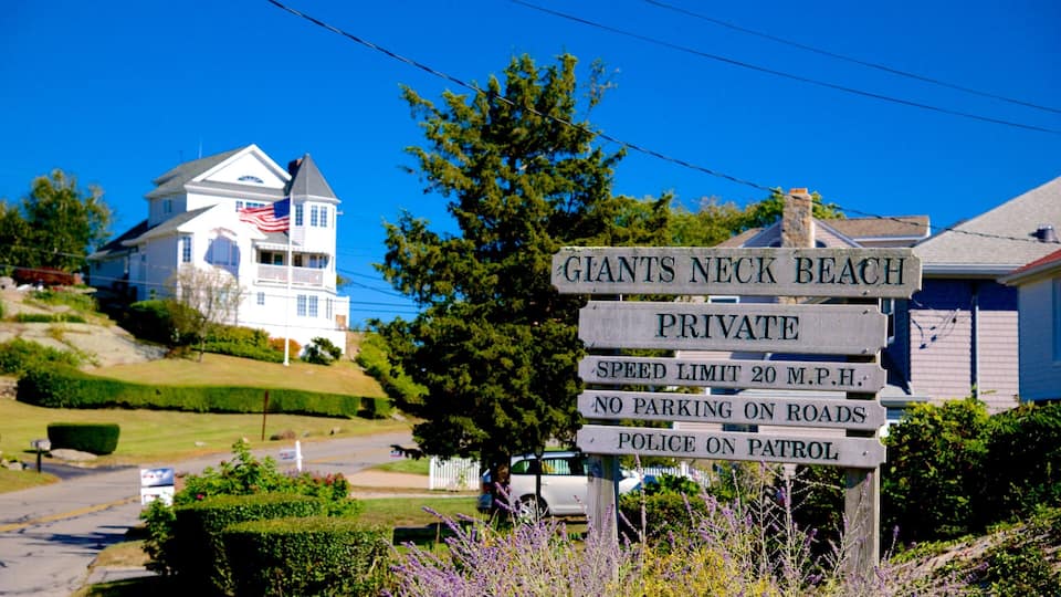 A sign indicating Giants Neck Beach is private with a speed limit of 20 mph and no parking on roads.
