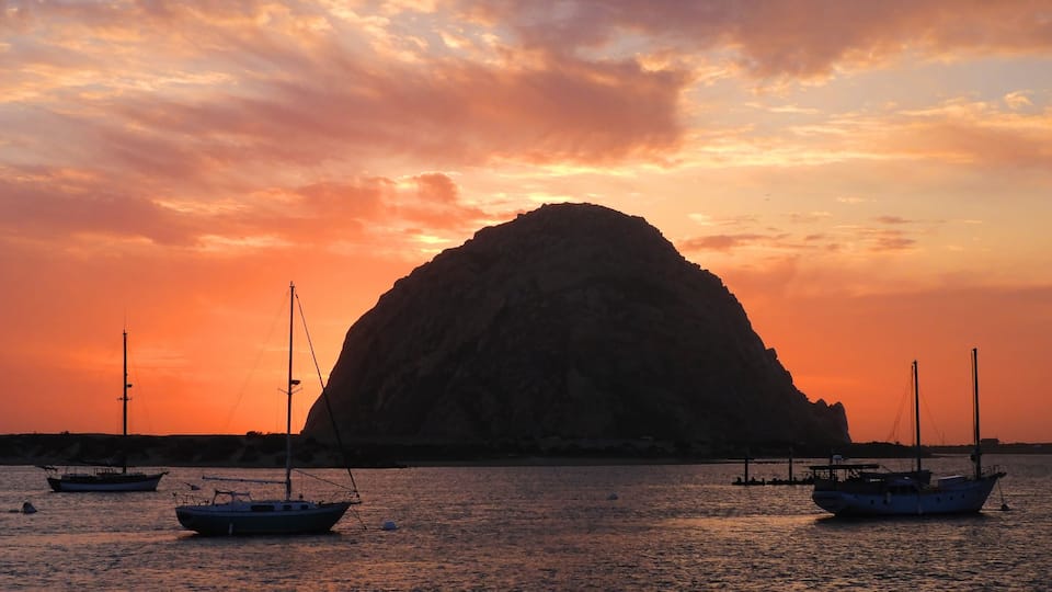 spectacular morro rock and sailboats at sunset in san luis obispo county on the central california coast