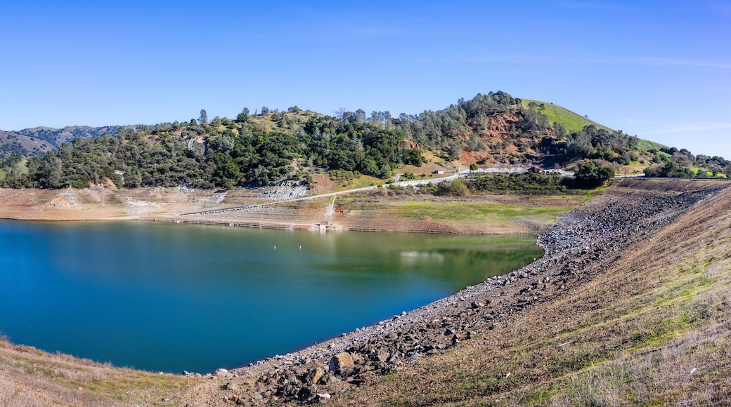 High angle view of Anderson Reservoir, a man made lake in Morgan Hill, managed by the Santa Clara Valley Water District, maintained at low level due to failure risk in case of earthquake; California