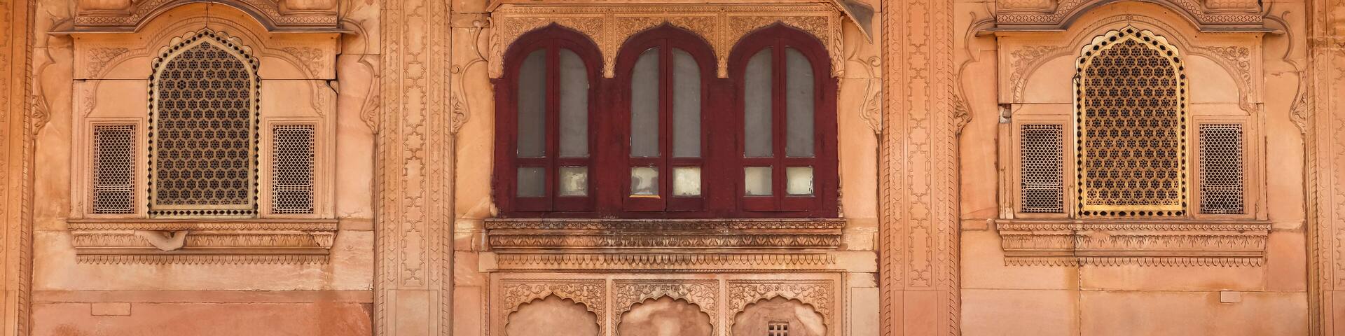 Beautifully designed windows of Nand Bhawan, the meeting hall, Deeg Palace, Deeg, Rajasthan, India.