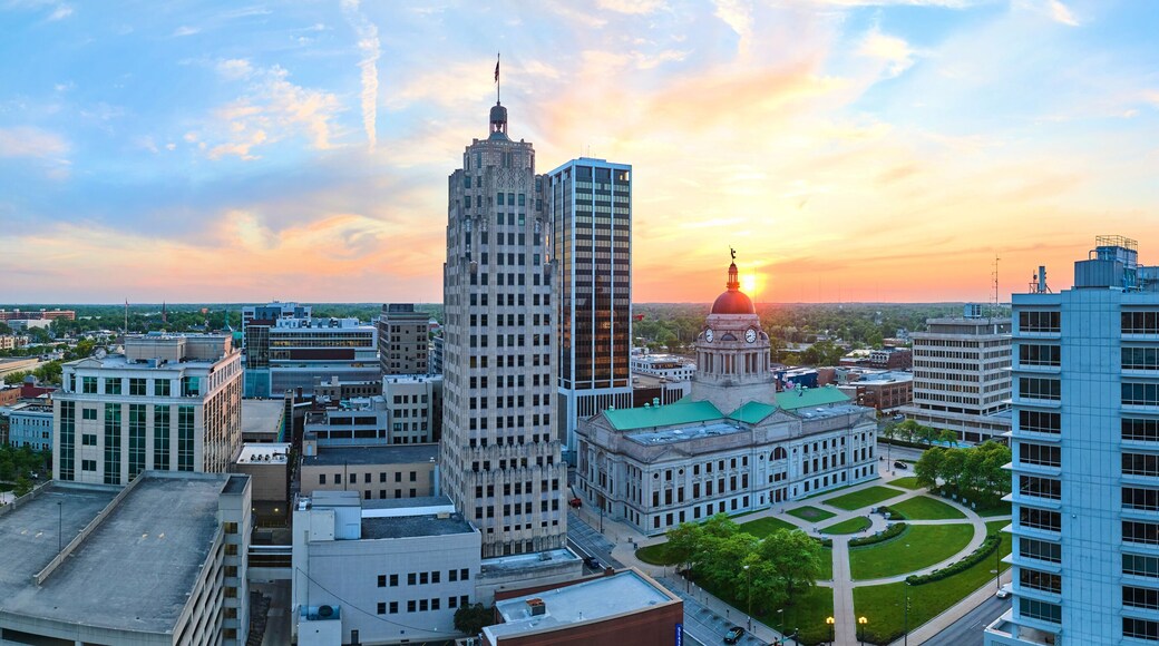 Panorama aerial downtown Fort Wayne golden morning sunrise breaking into brilliant blue skies
