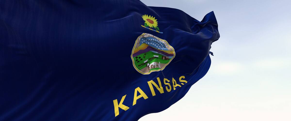 A flag with the word "KANSAS" and a state emblem.
